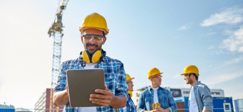 A group of construction workers standing next to each other.